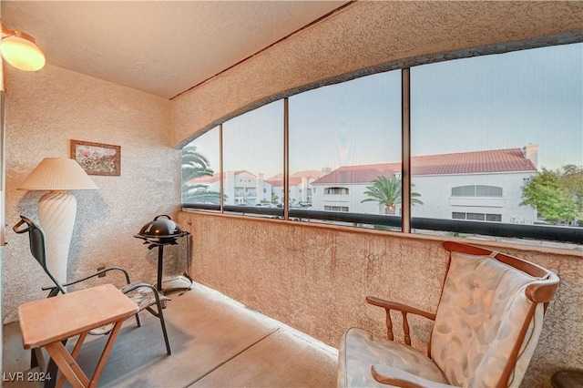 sitting room with lofted ceiling