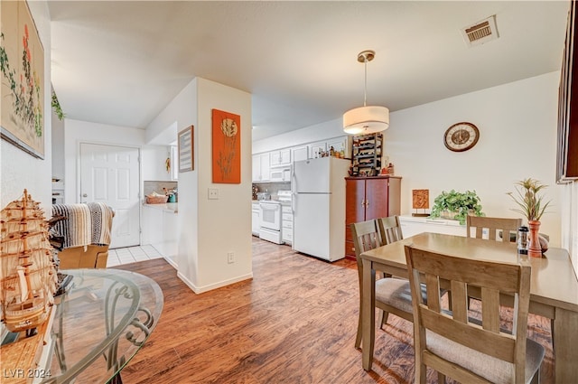 dining room featuring light hardwood / wood-style floors