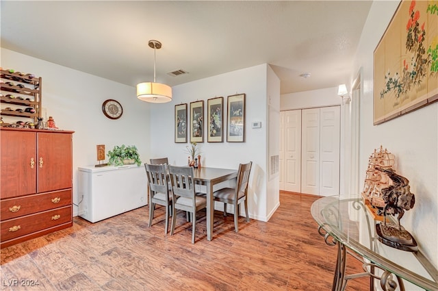 dining room featuring light hardwood / wood-style floors