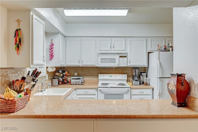 kitchen featuring white appliances, backsplash, a sink, and light countertops