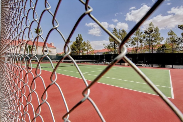 view of sport court featuring basketball hoop