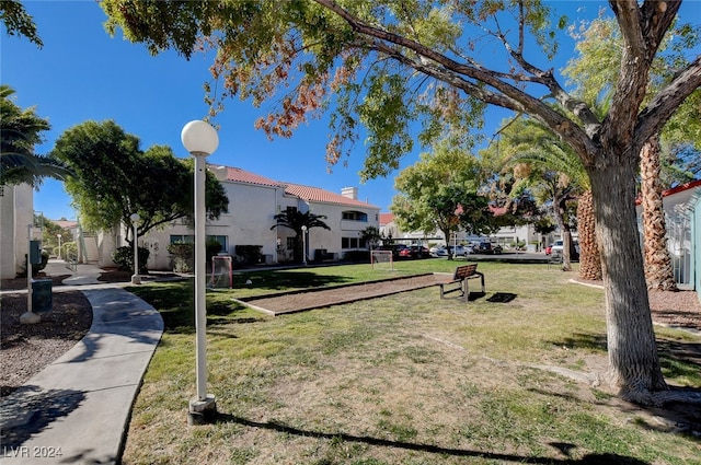 view of property's community featuring a yard