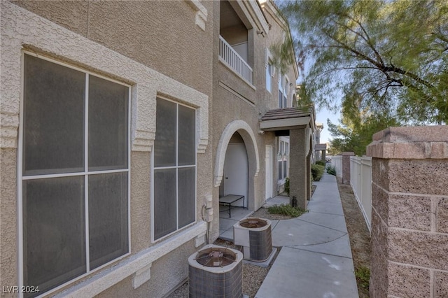 9975 Peace Way Unit 1058, Las Vegas, NV 89147 - view of home's exterior featuring central AC, stucco siding, and a patio