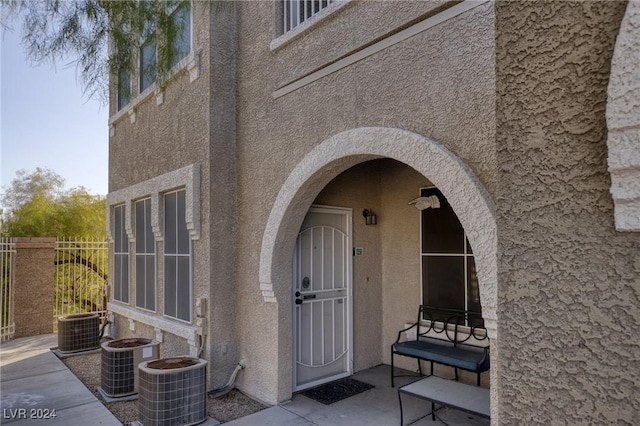 9975 Peace Way Unit 1058, Las Vegas, NV 89147 - view of exterior entry featuring cooling unit and stucco siding