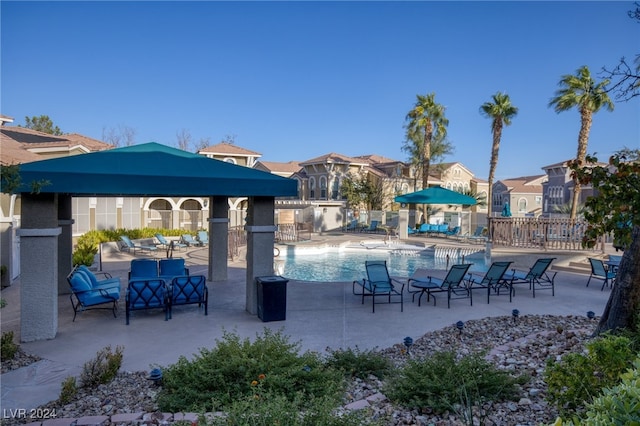 view of pool with a patio and a gazebo