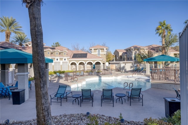 view of swimming pool with a patio