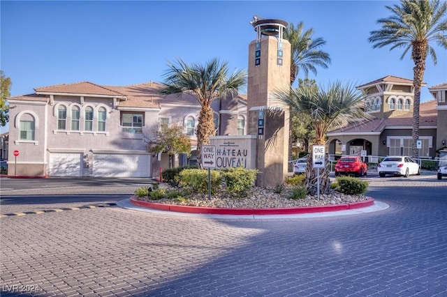 9975 Peace Way Unit 1058, Las Vegas, NV 89147 - community sign with driveway and a garage