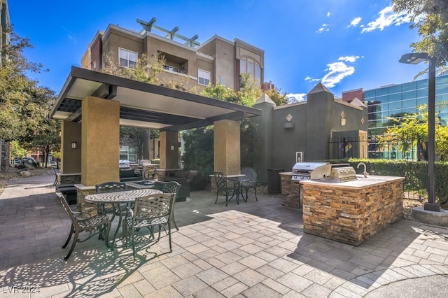 view of patio featuring area for grilling and exterior kitchen