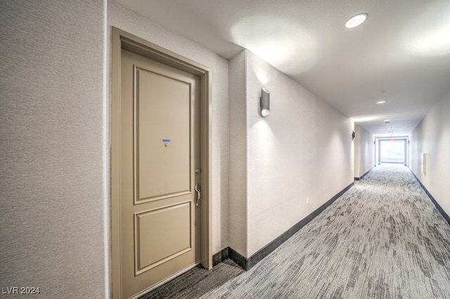 hallway with hardwood / wood-style floors