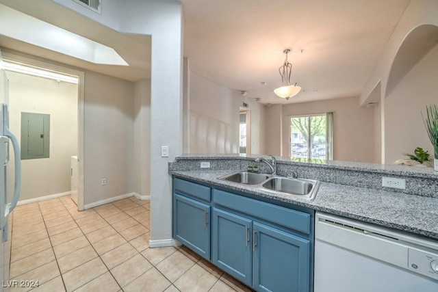 kitchen with white dishwasher, blue cabinets, sink, decorative light fixtures, and light tile patterned flooring