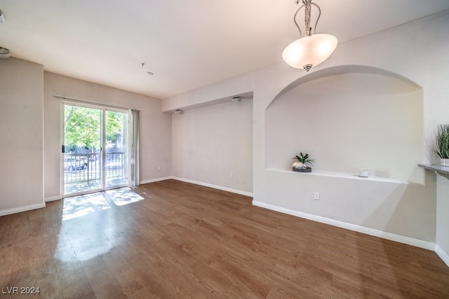 spare room with dark hardwood / wood-style flooring