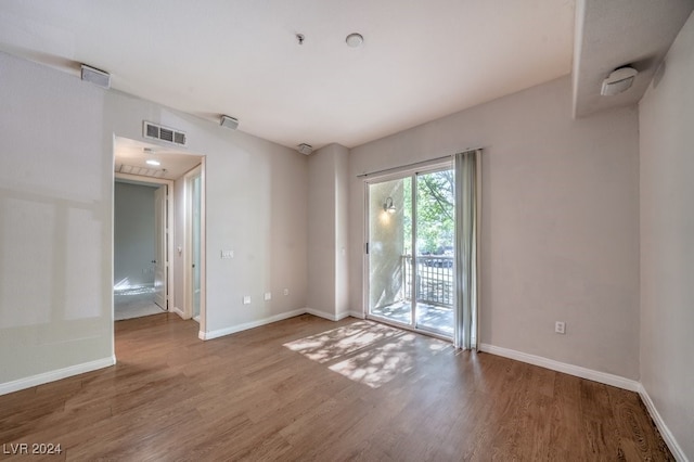 empty room with wood-type flooring