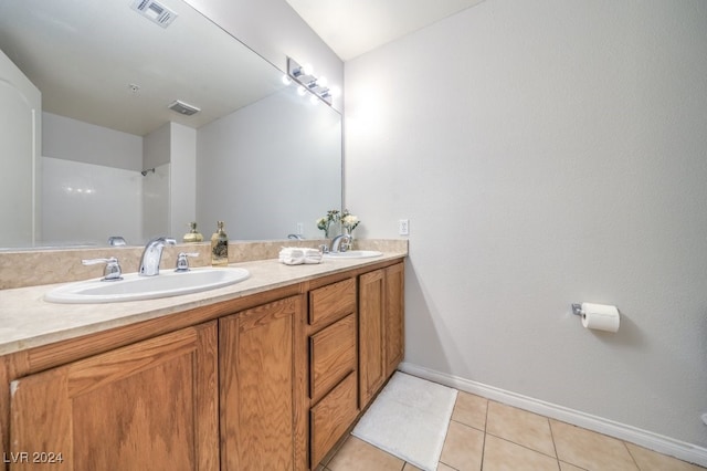 bathroom with vanity and tile patterned floors