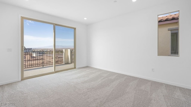 unfurnished room with carpet, baseboards, and recessed lighting