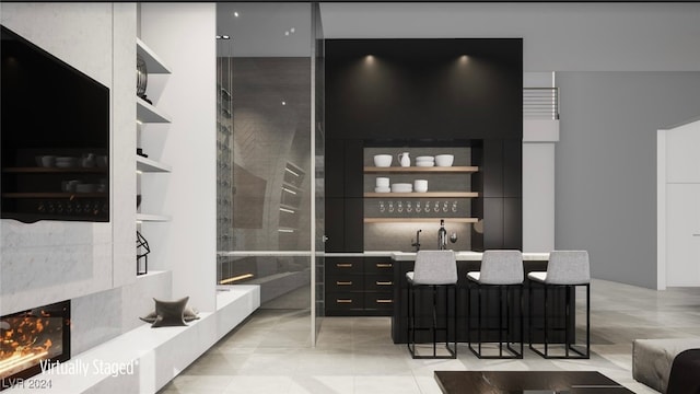 bar featuring light tile patterned floors and a high end fireplace