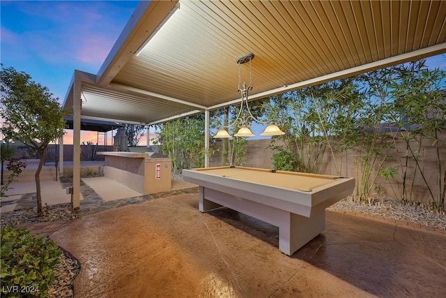 view of patio terrace at dusk