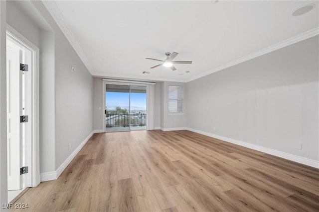 empty room with ceiling fan, light hardwood / wood-style floors, and ornamental molding