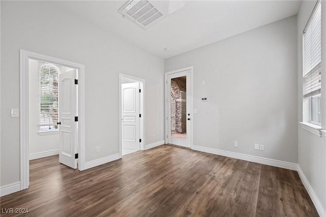 unfurnished room featuring dark hardwood / wood-style floors