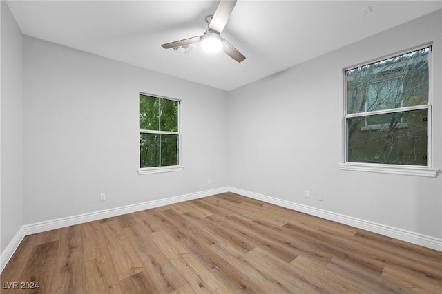 unfurnished room featuring ceiling fan and light hardwood / wood-style floors