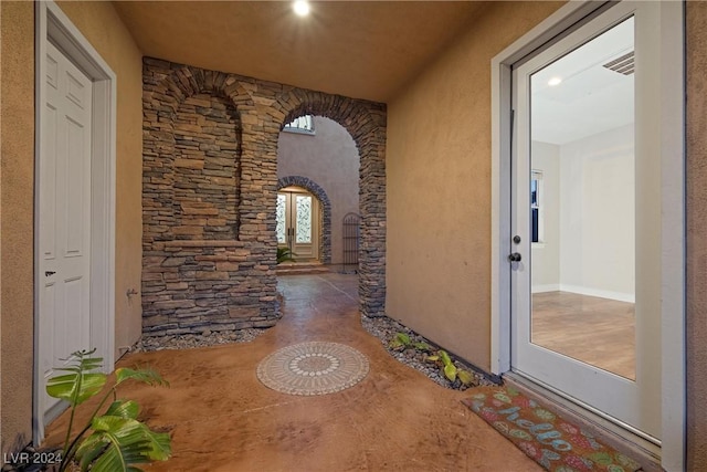 corridor with arched walkways and visible vents