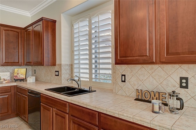 kitchen with backsplash, tile countertops, dishwasher, crown molding, and sink