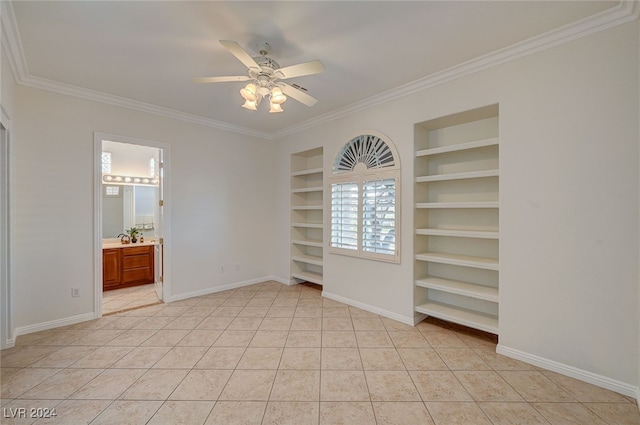 interior space featuring ceiling fan, crown molding, light tile patterned floors, and ensuite bath