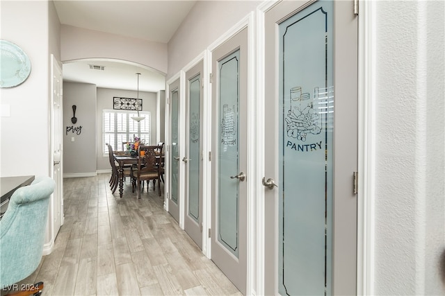 hallway featuring light hardwood / wood-style flooring