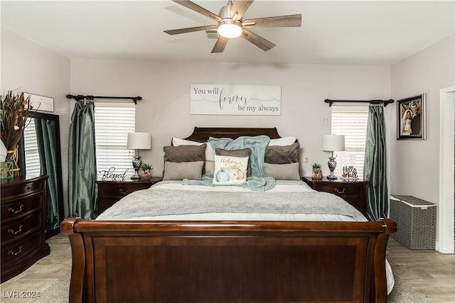 bedroom featuring light hardwood / wood-style floors and ceiling fan