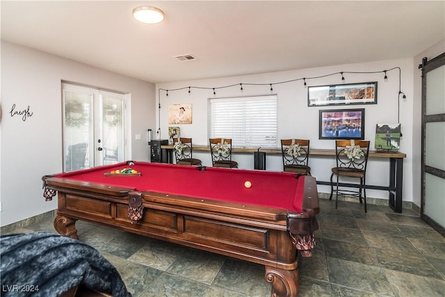 recreation room featuring visible vents, billiards, baseboards, and stone finish floor