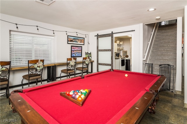 rec room with independent washer and dryer, pool table, and a barn door