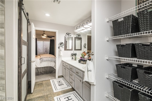 bathroom with vanity and ceiling fan