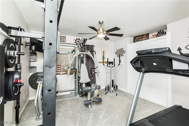 workout room featuring light colored carpet and ceiling fan