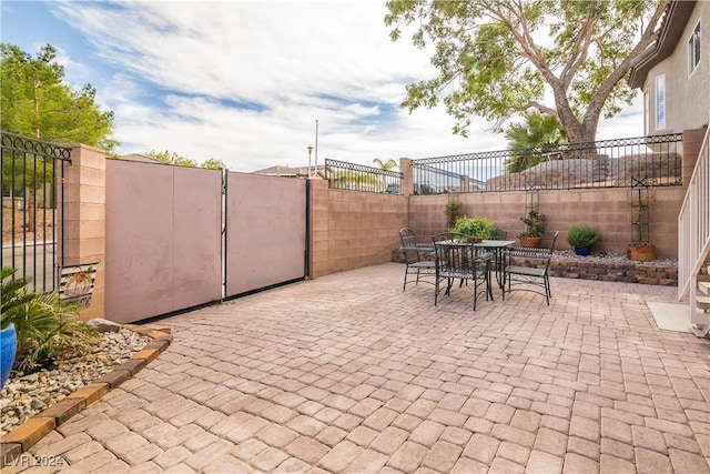 view of patio / terrace featuring a fenced backyard and outdoor dining space