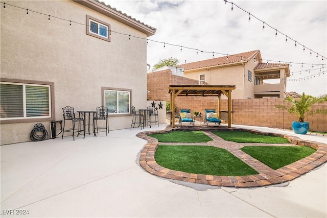 view of yard with a patio, a fenced backyard, and a pergola