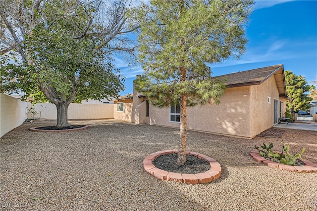 back of house featuring a patio area