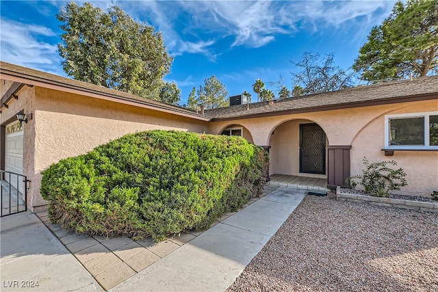 view of exterior entry featuring a garage