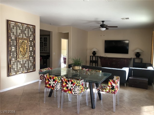 tiled dining room with ceiling fan