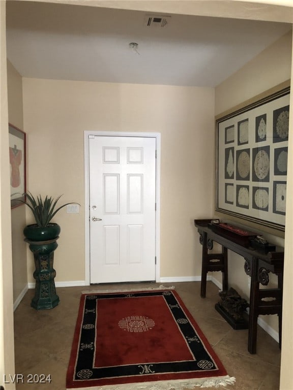 view of tiled foyer entrance