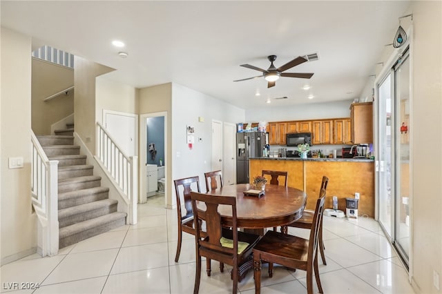 dining room featuring light tile patterned floors and ceiling fan