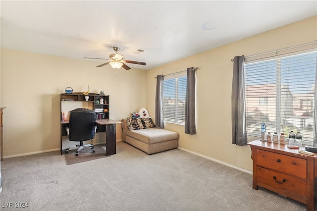 office featuring light carpet and ceiling fan