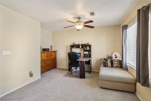 office space with light carpet and ceiling fan