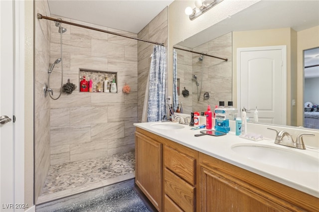 bathroom featuring vanity, tile patterned floors, and a shower with shower curtain