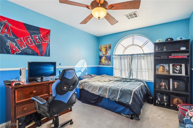 carpeted bedroom featuring ceiling fan