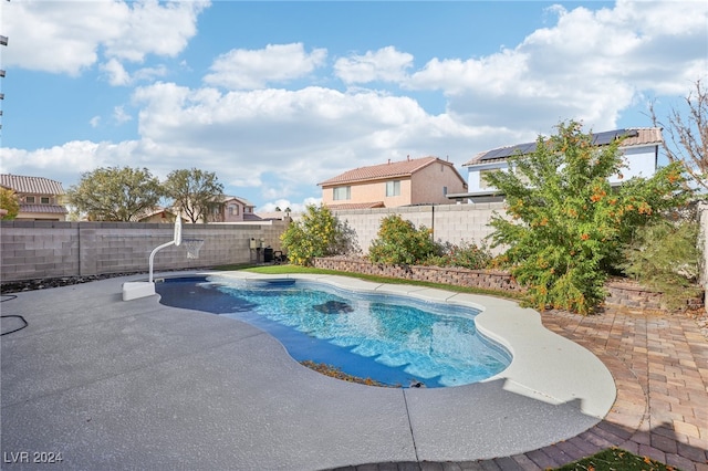 view of swimming pool with a patio