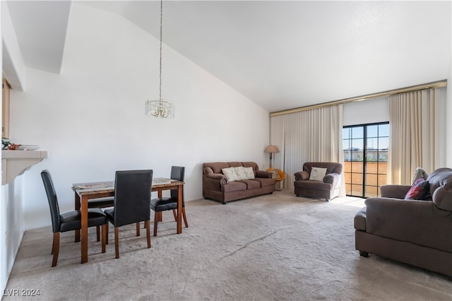 carpeted living room featuring high vaulted ceiling