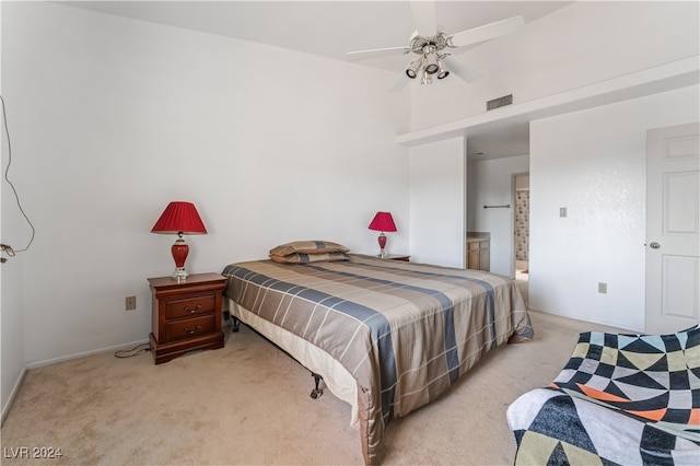 bedroom featuring light carpet and ceiling fan