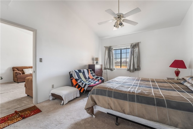 carpeted bedroom featuring lofted ceiling and ceiling fan