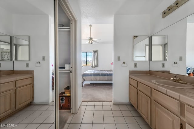 bathroom featuring vanity, ceiling fan, and tile patterned flooring