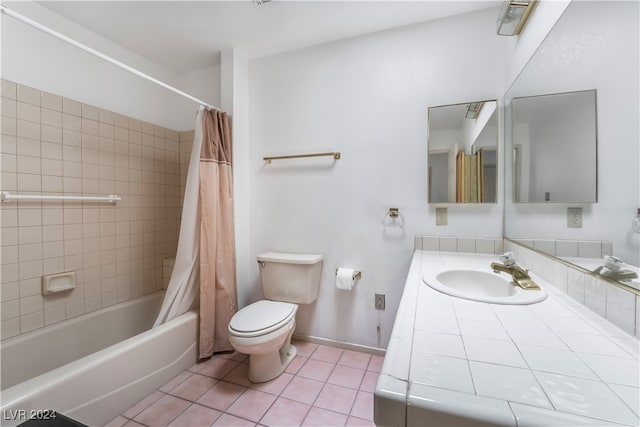 full bathroom with vanity, toilet, shower / bath combo with shower curtain, and tile patterned flooring