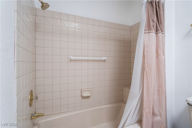 bathroom featuring shower / bath combo with shower curtain